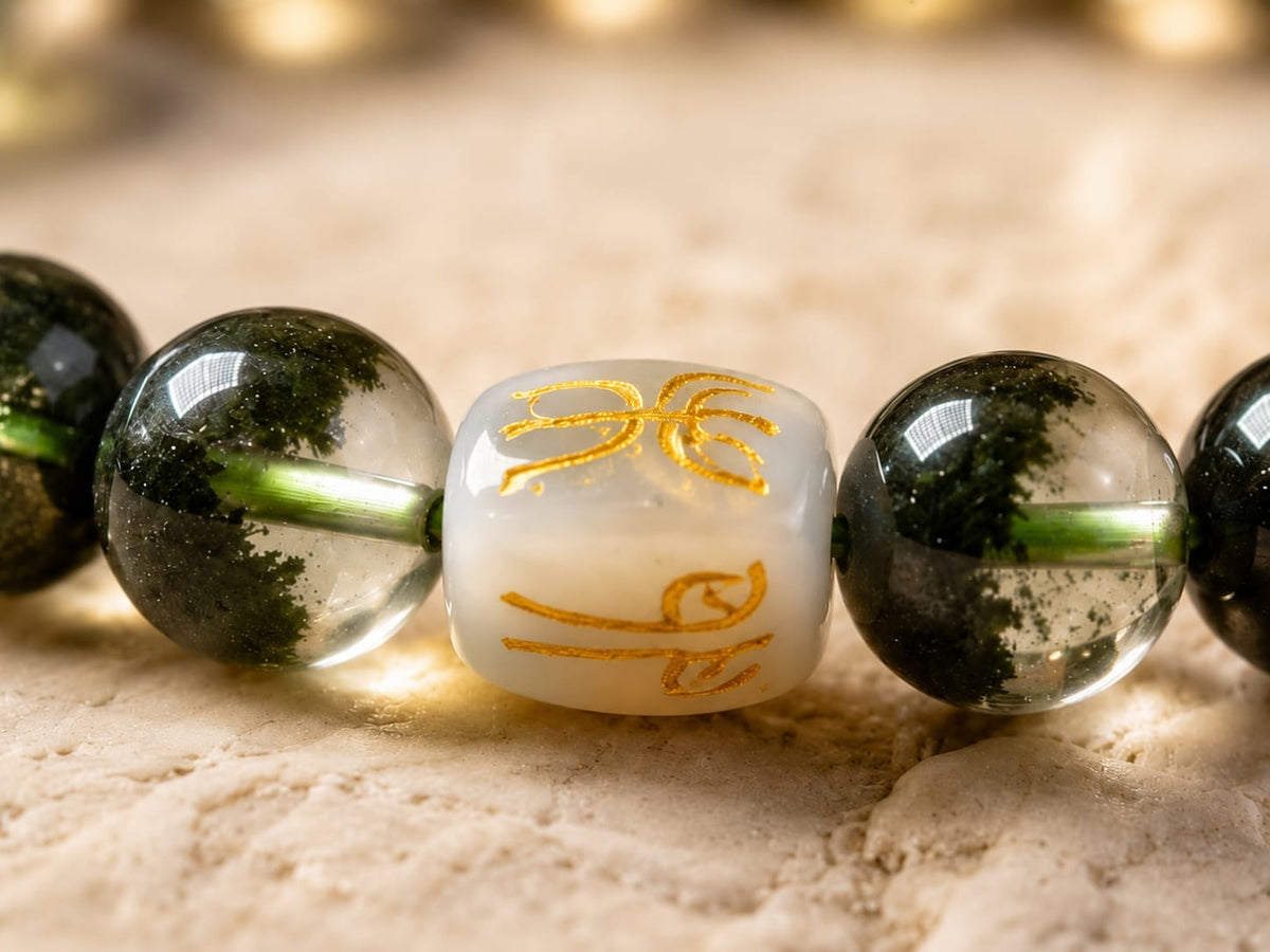 Close-up of a Green Phantom Quartz Bracelet with a Hetian jade formation charm, presented beside text explaining the Three Harmonies Wood design, symbolizing growth, vitality, prosperity, and natural energetic alignment.