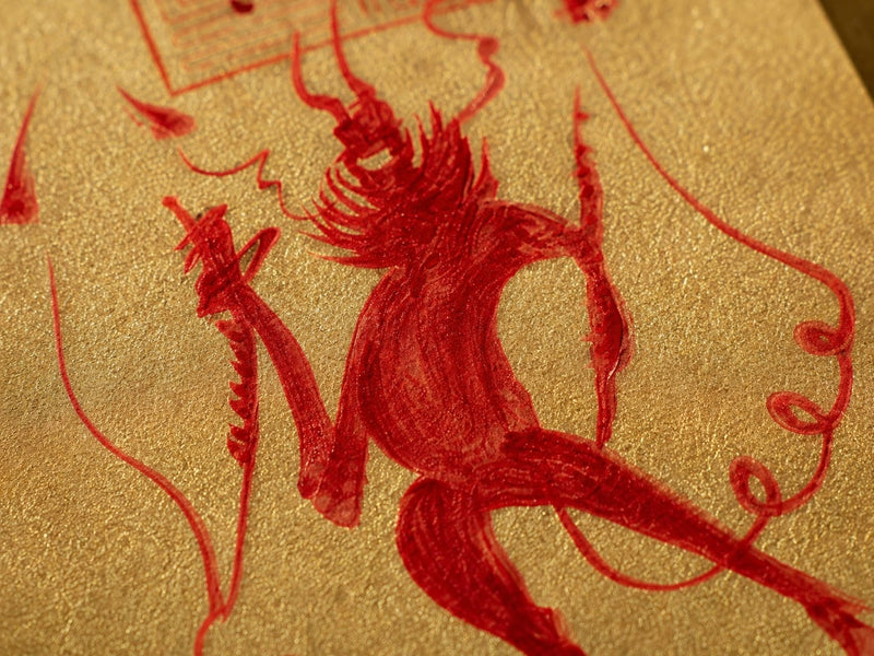 Detail of Wang Lingguan’s central figure drawn in cinnabar red on gold talisman paper, emphasizing dynamic brushwork, flowing lines, and the talisman’s commanding protective presence.
