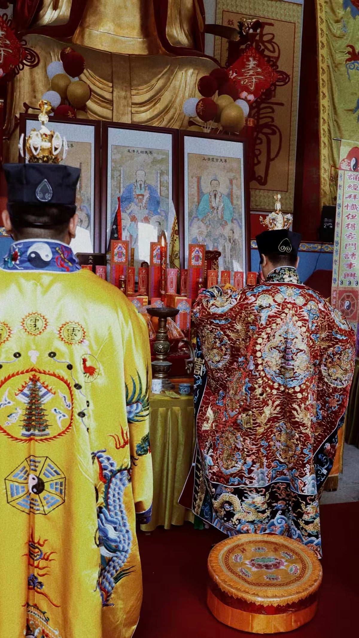 Two practitioners performing a traditional Chinese divination ritual in front of ancestral portraits, illustrating the personalization, classical methods, and symbolic guidance provided by experienced masters.