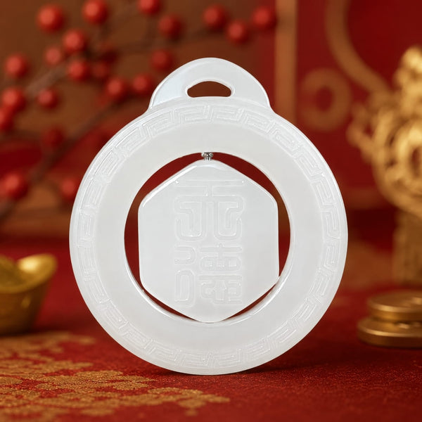 The Heavenly Blessing Talisman Pendant displayed on a rich red silk cloth with gold accents, highlighting its white jade craftsmanship and symbolic blessing motifs.