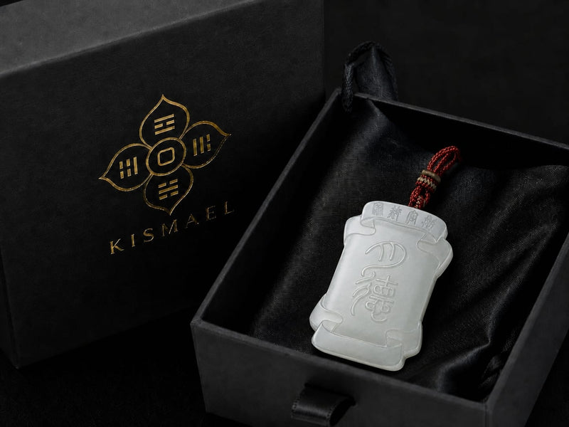 The Moon Virtue jade pendant resting inside the black satin-lined gift box, showing the polished white jade plaque and engraved details. The box is slightly open to reveal the pendant, emphasizing protection and refined presentation.