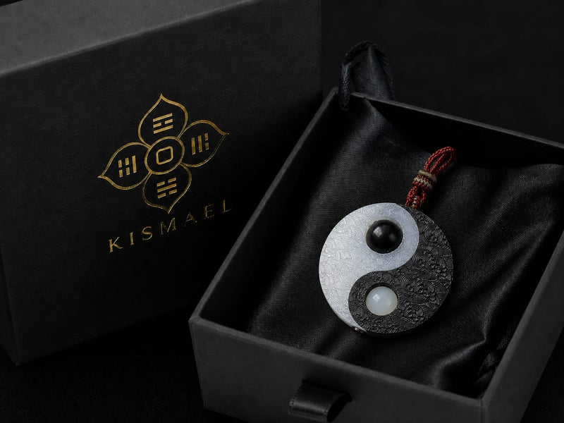 Taiji Yin Yang pendant displayed inside a black KISMAEL gift box with satin lining, designed to protect and present the charm beautifully.