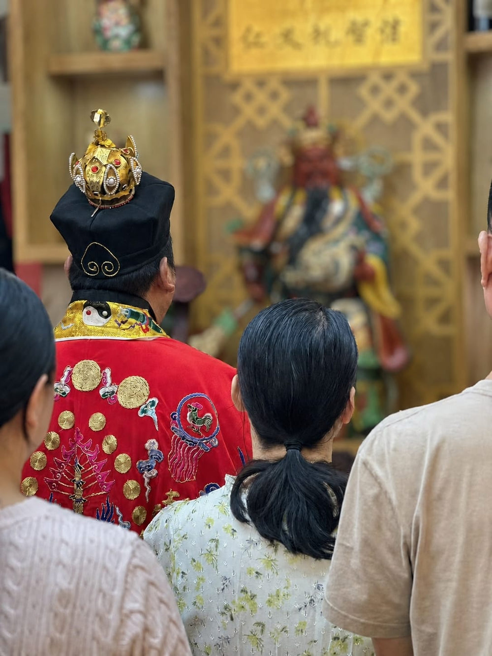 A traditional Taoist ritual ceremony with practitioners facing an altar, representing spiritual consultation, symbolic blessing, and ancient Chinese divination culture.