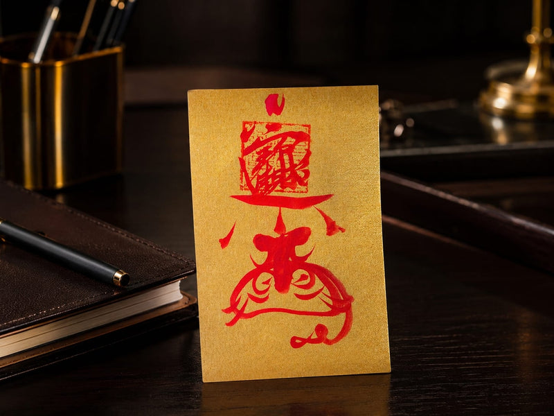 Golden Wealth Protection Talisman displayed on an elegant office desk beside a notebook and pen, symbolizing steady income energy, focus, and financial intention.