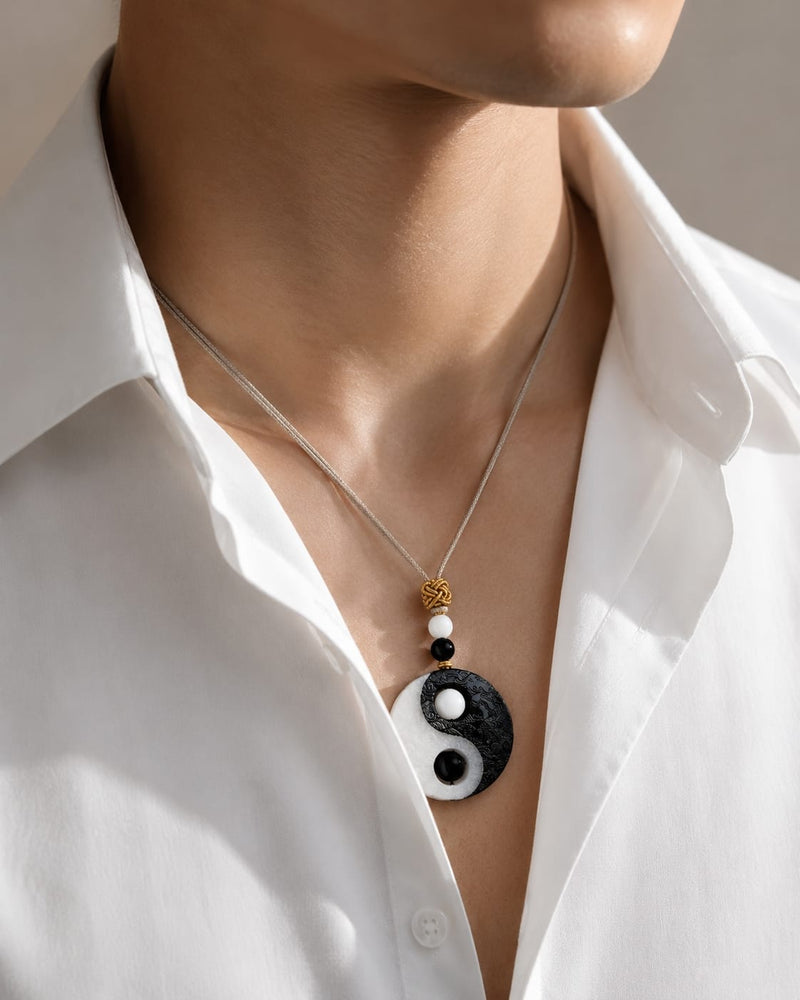 Male wearing the Taiji Yin Yang pendant over a white shirt, showing how it sits naturally at the chest for everyday mindful wear and professional style.